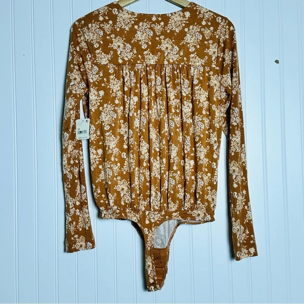 FREE PEOPLE Turnt Surplice Bodysuit in a copper floral print Medium NWT - Picture 10 of 11